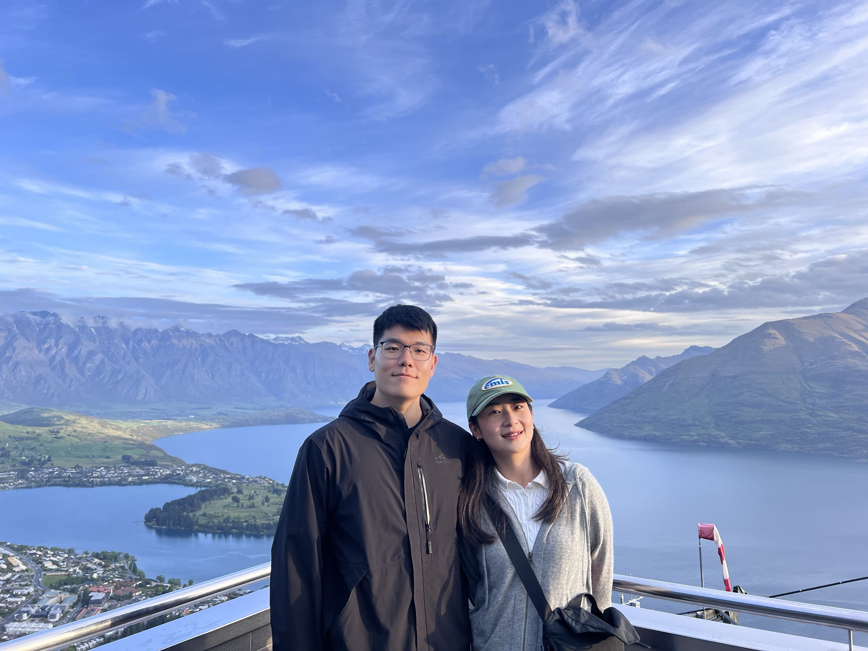 Gyuchan and Yuting overlooking the mountains and lake