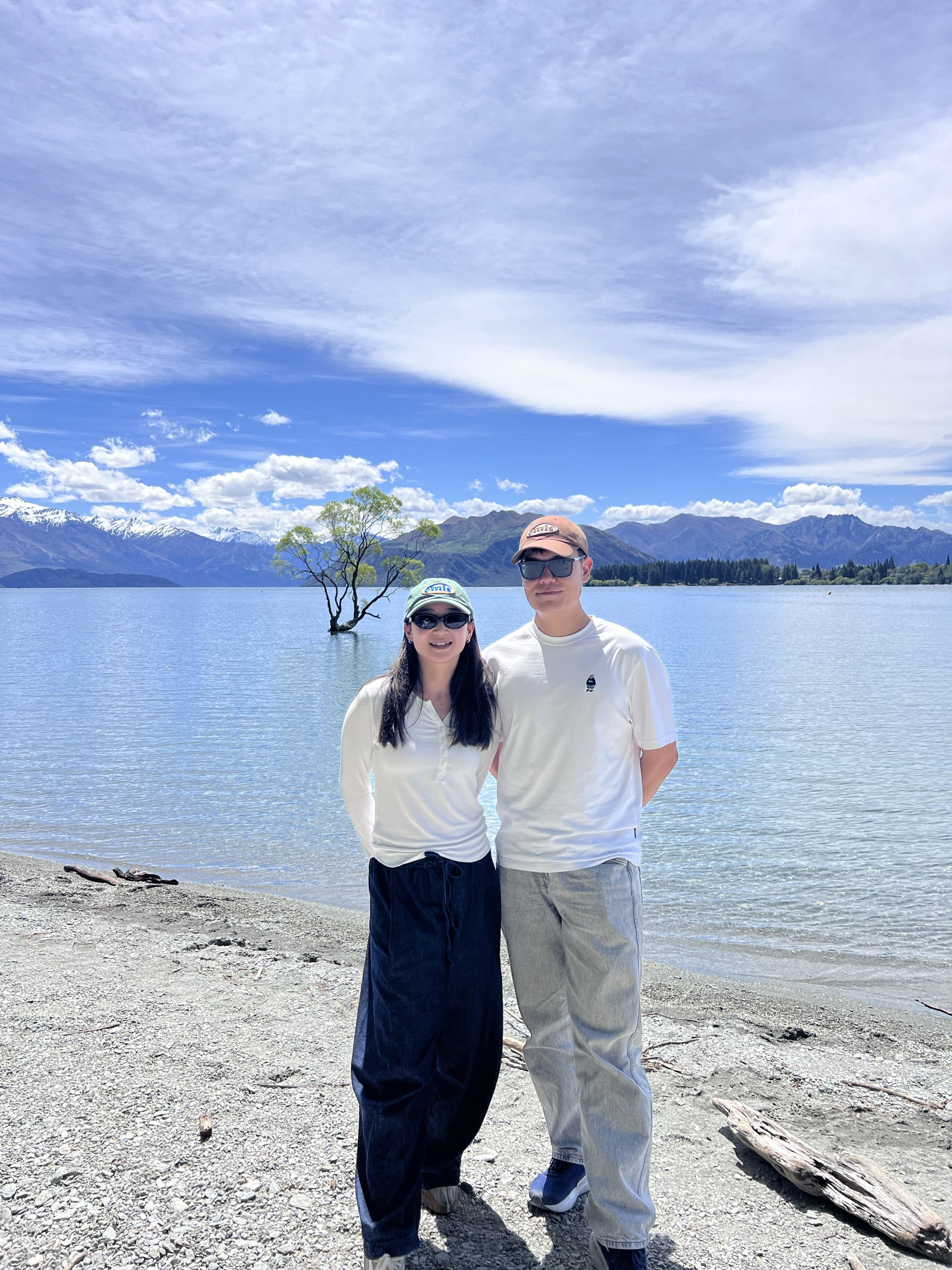 Gyuchan and Yuting standing beside a mountain lake